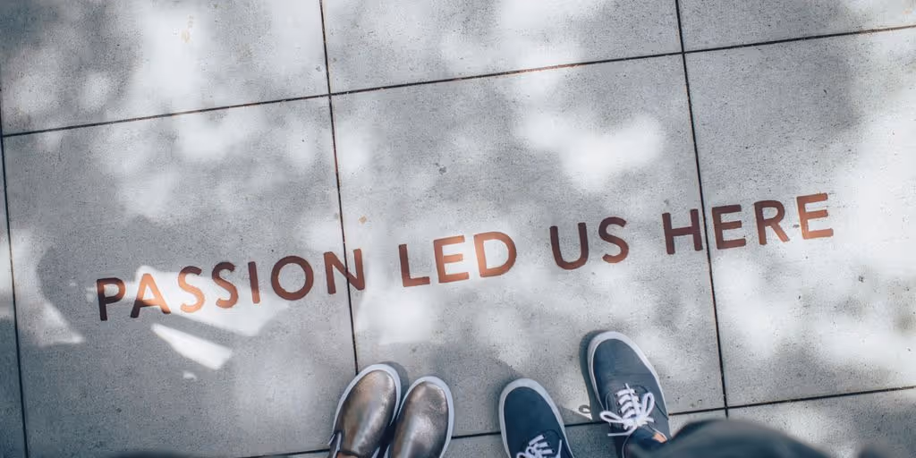 two person standing on gray tile paving