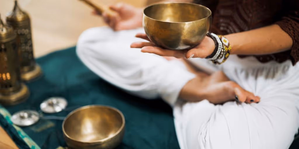 person in white dress shirt holding brown wooden chopsticks