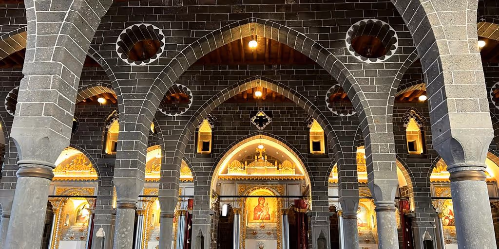 a church with arches and a clock on the wall