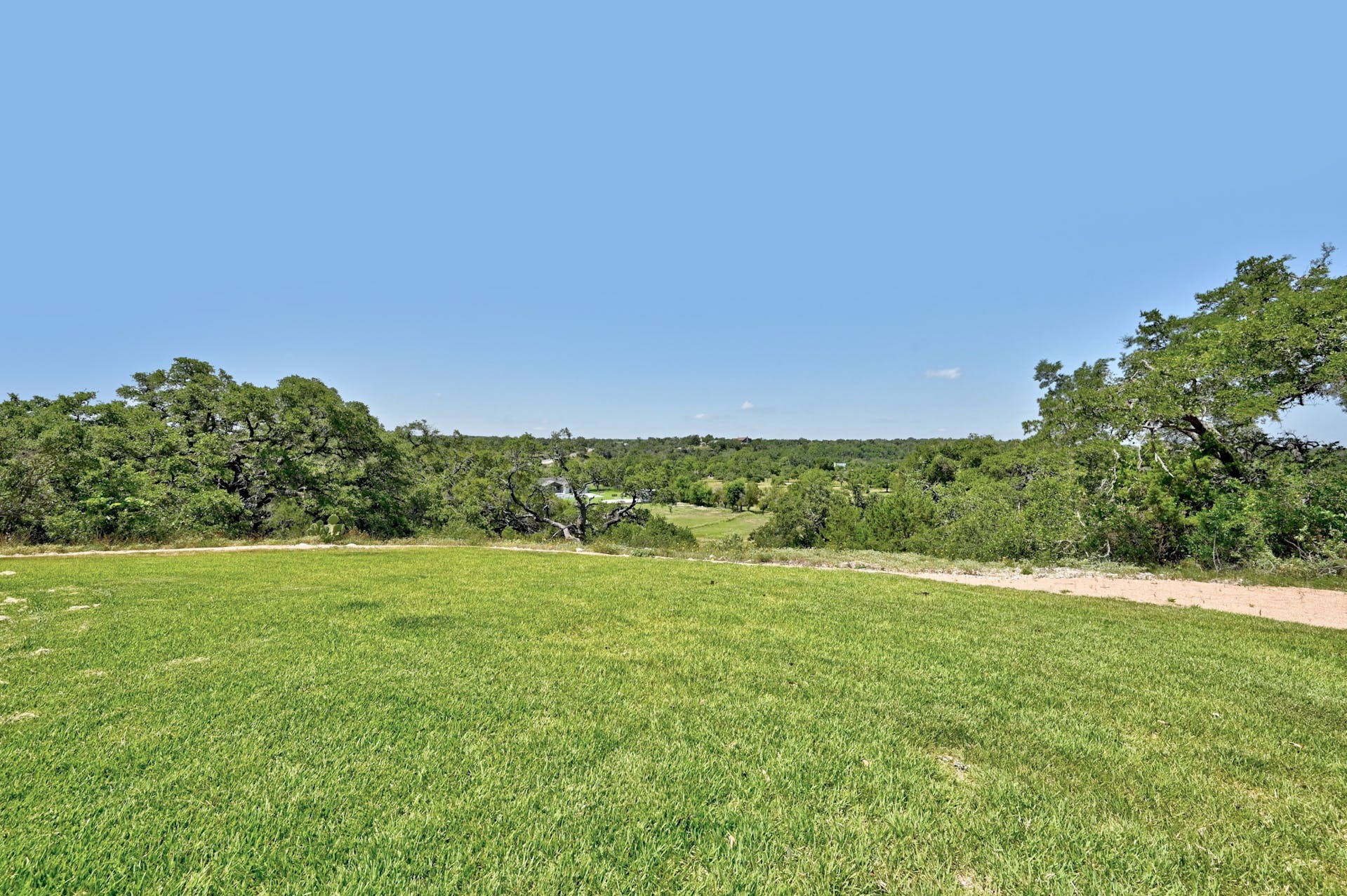 View across the lawn to wooded hills