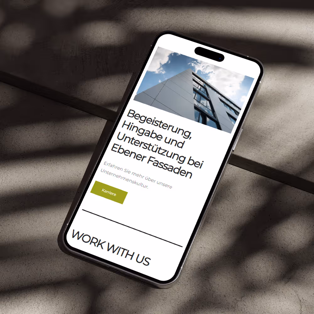 Grafische Darstellung einer Website auf einem Iphone. Iphone liegt auf dem Boden.