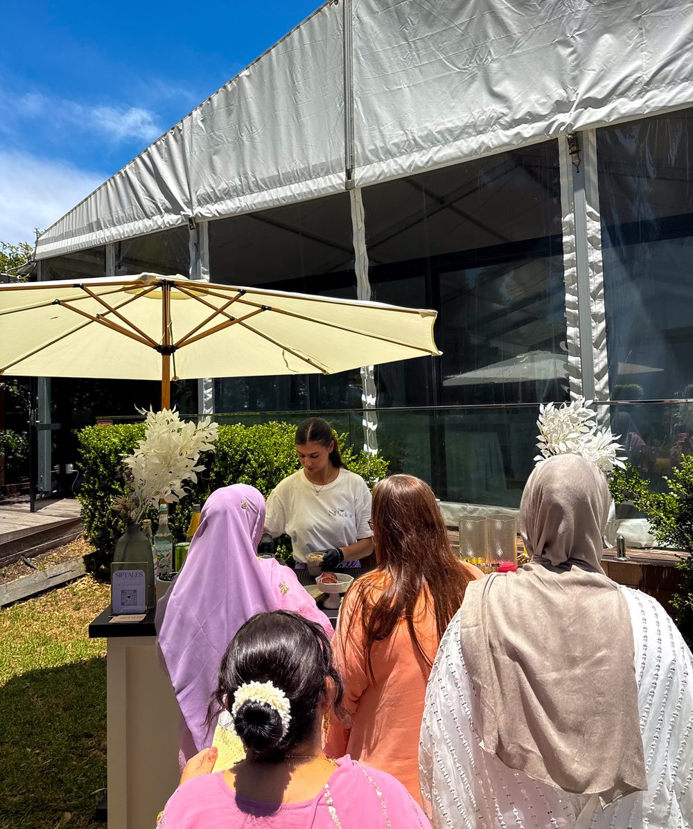 Guests served at a female-only garden gathering