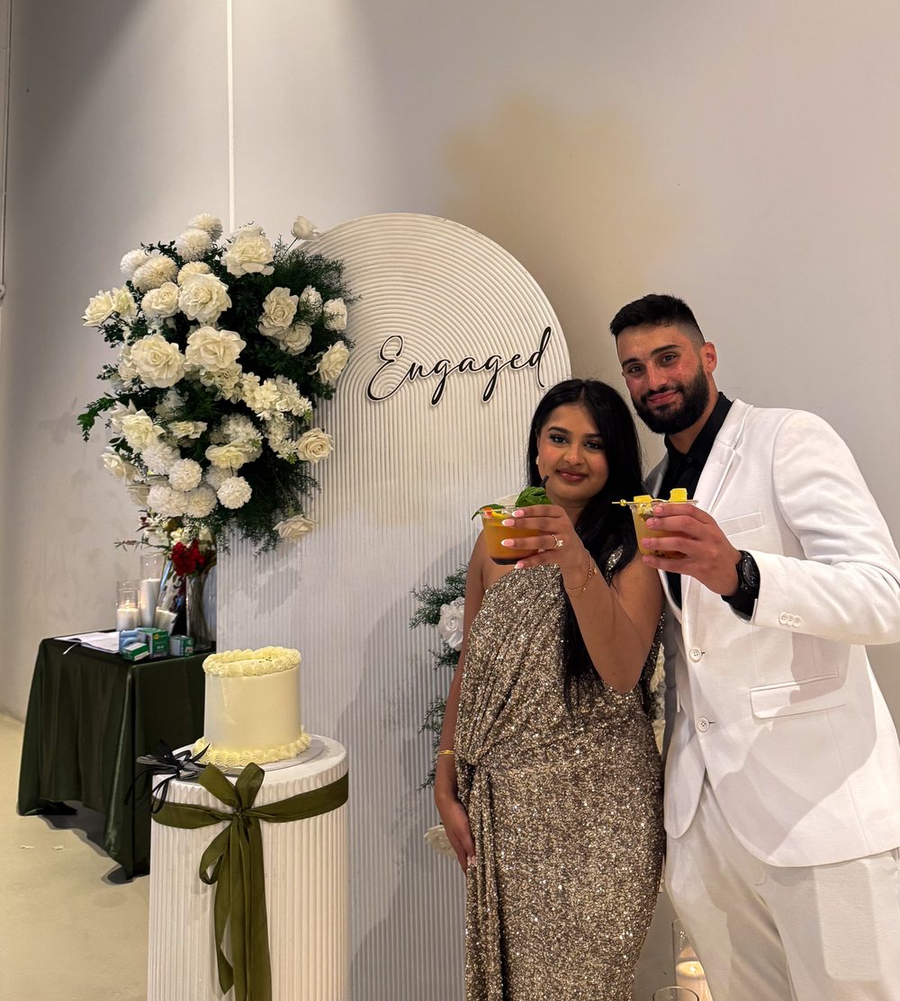 Couple celebrating their engagement with mocktails