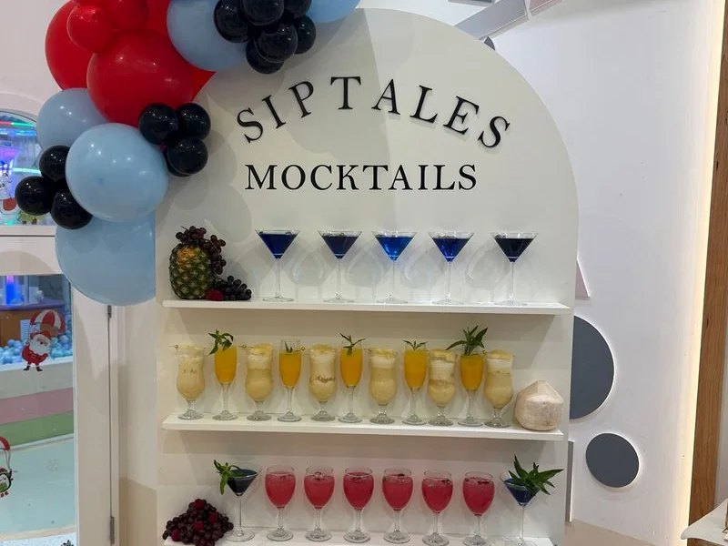 SipTales drink wall with shelves of mocktails