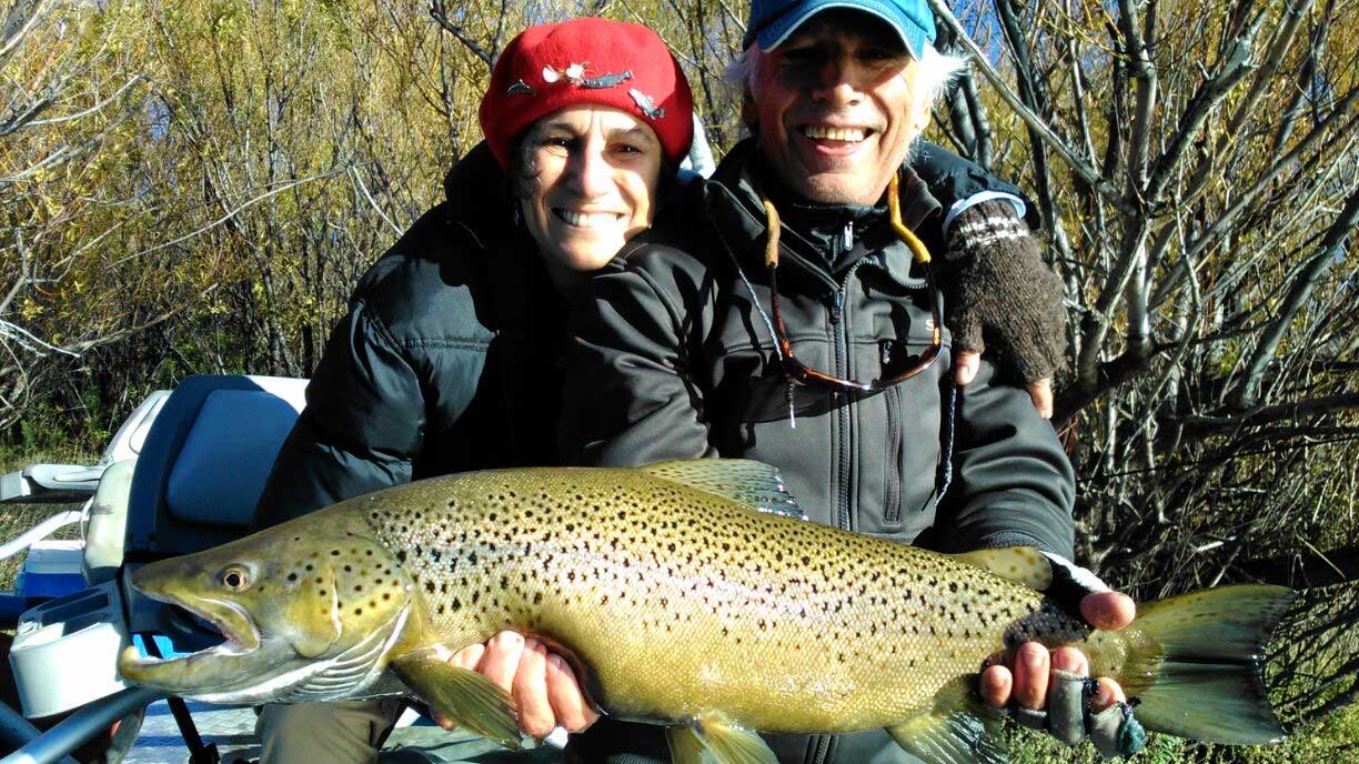 Anglers holding a trophy trout together at Bravo Sur Lodge