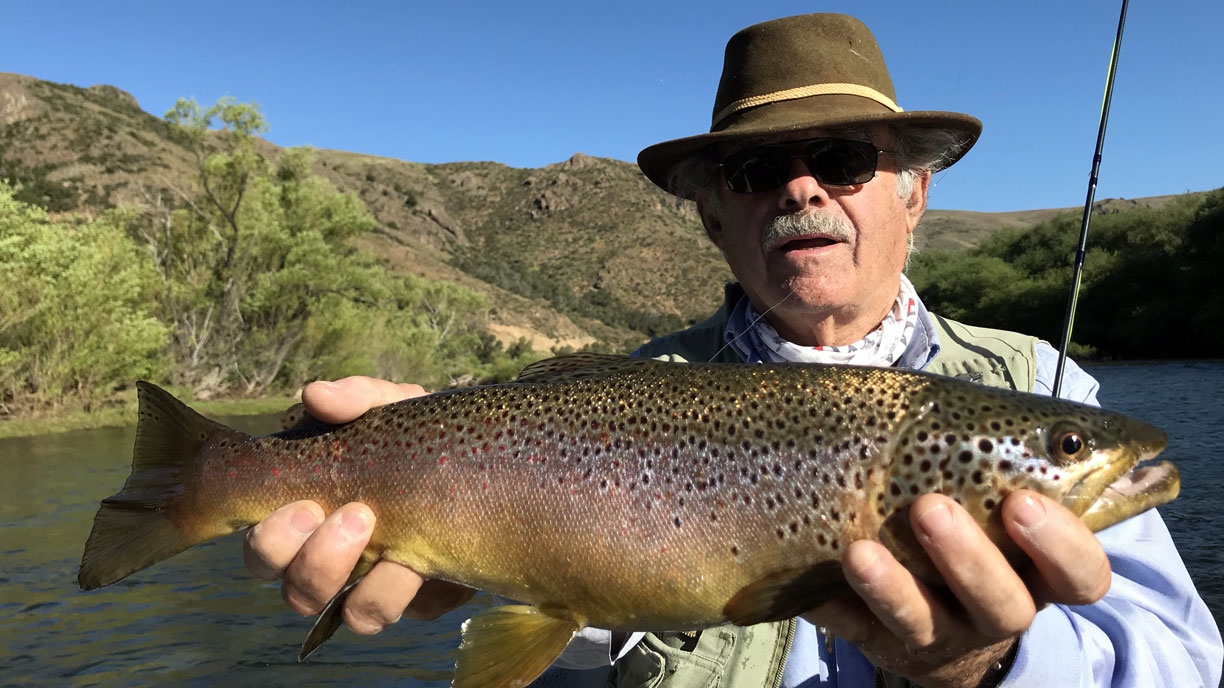 Angler with a trout catch in Northern Patagonia at Bravo Sur Lodge