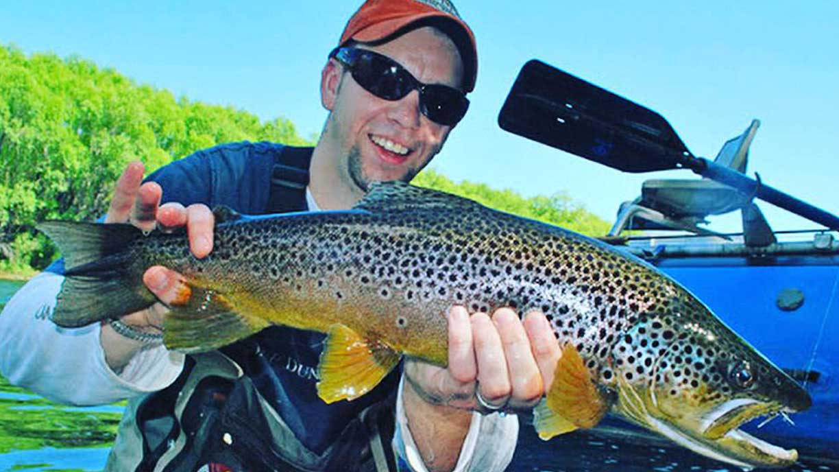 Guest with a trout catch at Bravo Sur Lodge