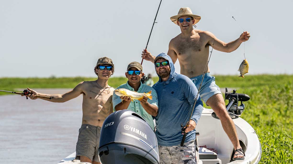 Group of anglers with golden dorado