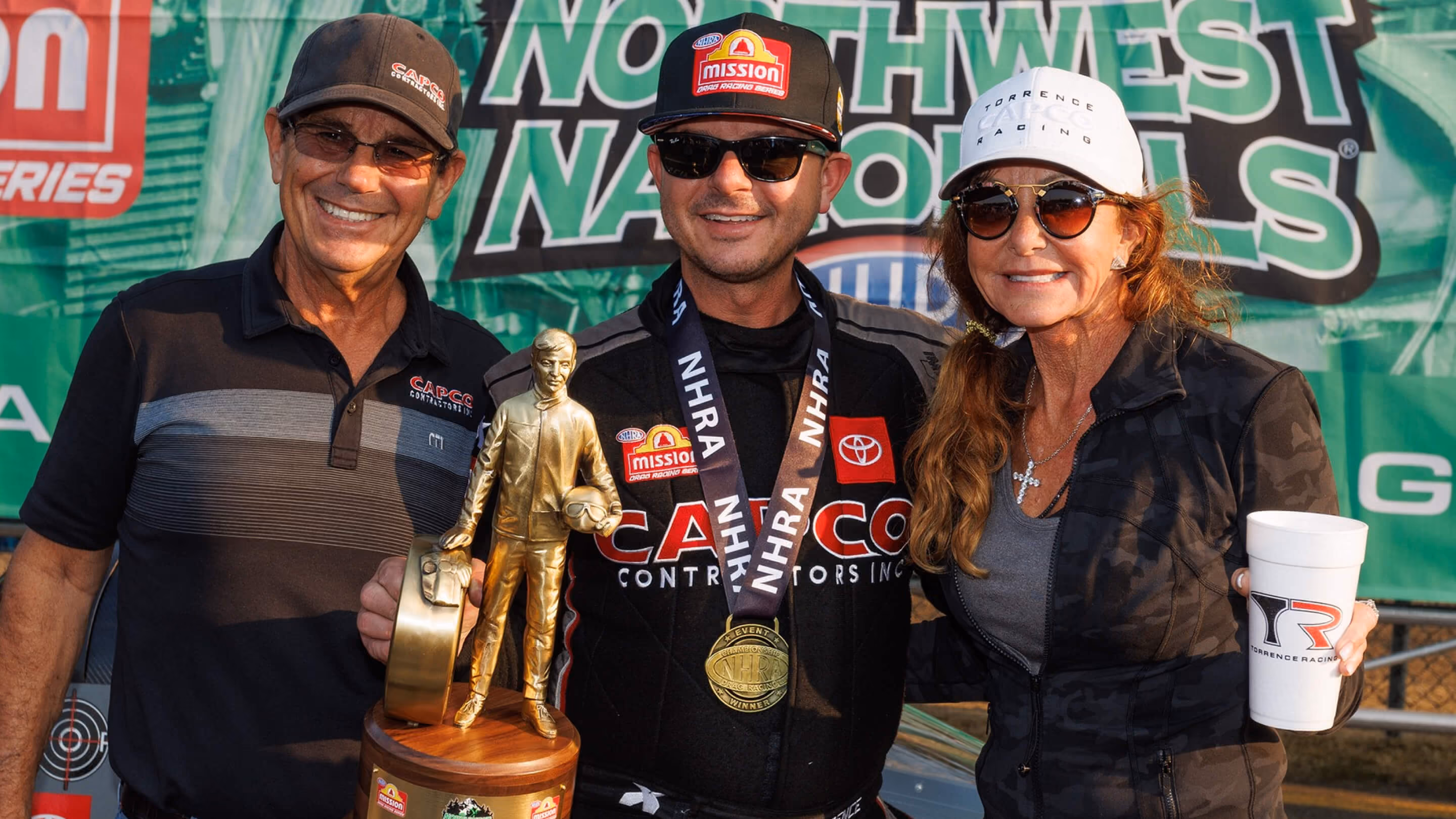 Torrence family in the Winner's Circle after winning an NHRA Top Fuel Dragster race