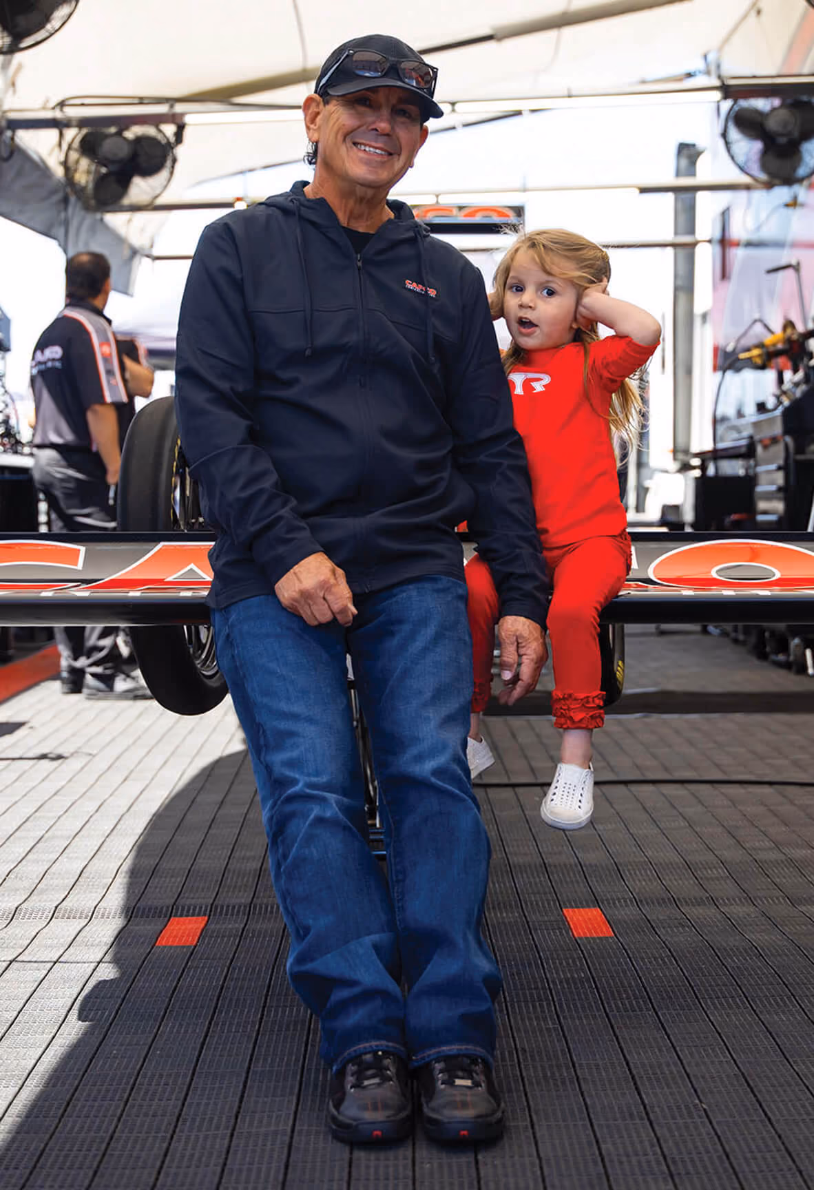 Steve and Natalie Torrence hold their daughter after winning an NHRA National Event in St. Louis, Missouri.