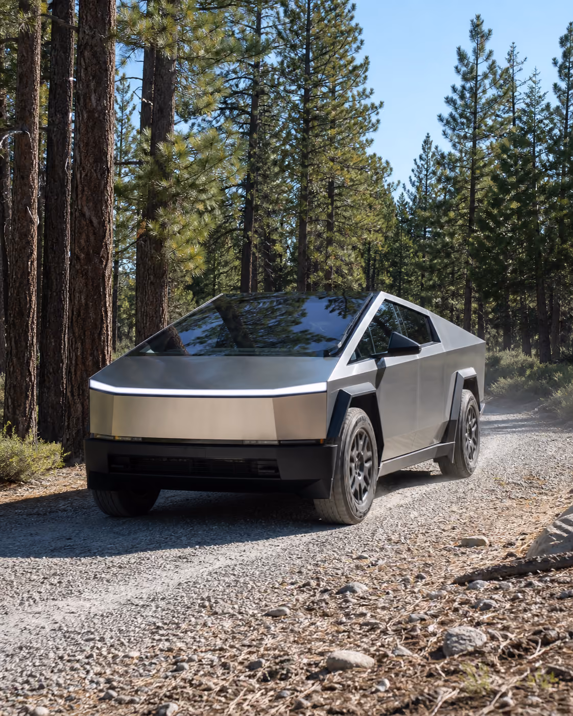 Tesla Cybertruck at a campsite with camping gear

