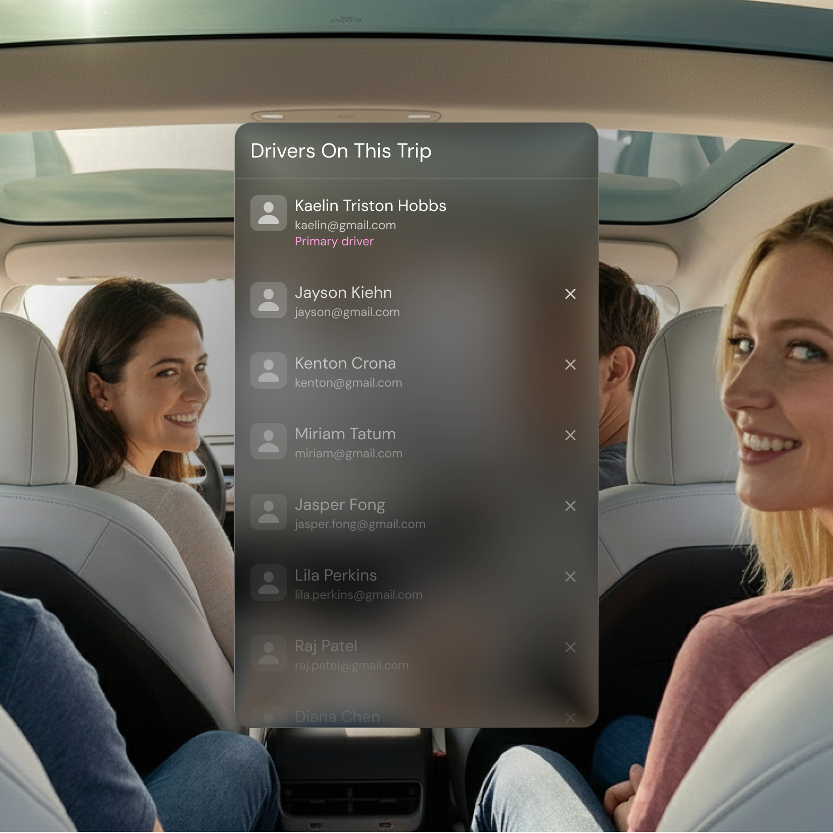 Two smiling women sitting inside a Tesla car with a digital overlay showing a list of drivers on this trip.