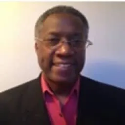 Profile image of Robert Scott, CTO & Co-Founder of EON Collectiv wearing red shirt and black jacket.
