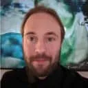 Profile picture of Kevin Jahs, CEO of Yjs with long brown hair and beard.