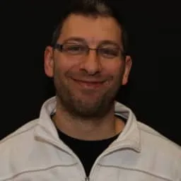 In the photo, a smiling Vincent Lapointe in glasses.