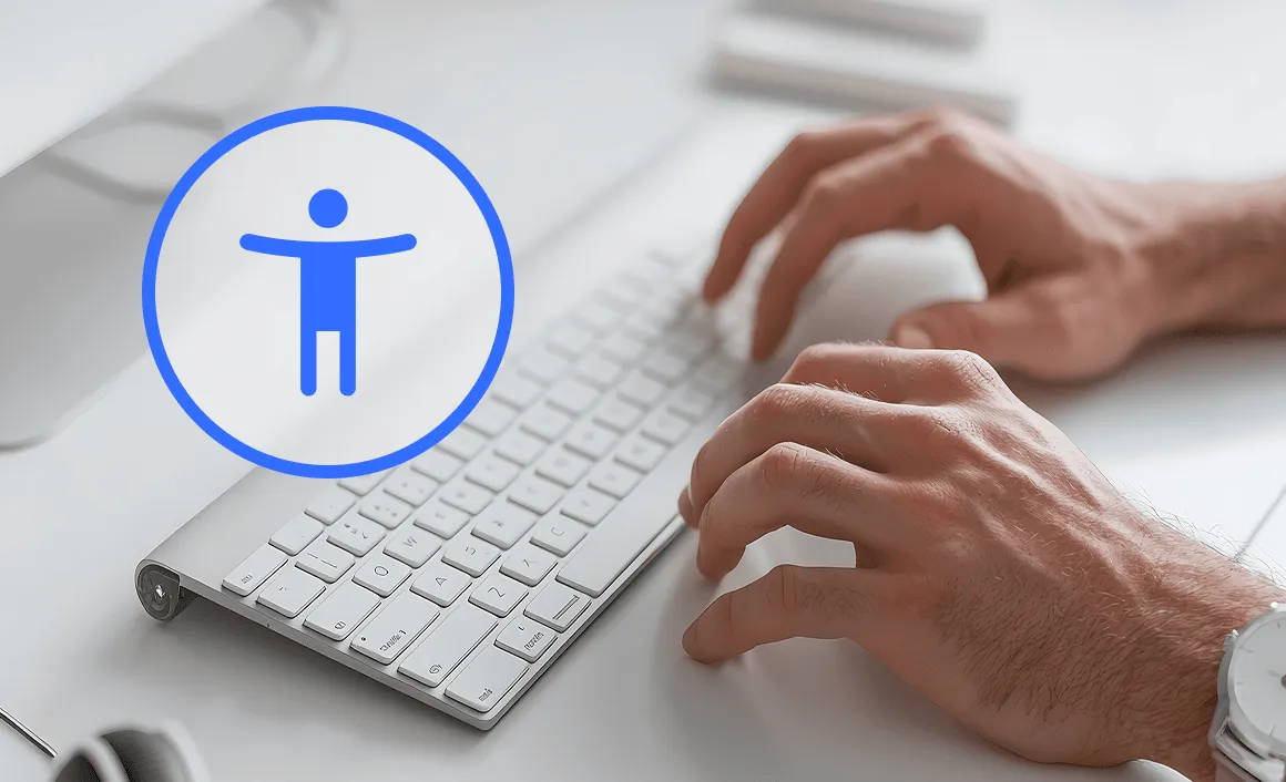 Close-up of hands typing on a white keyboard with a large blue accessibility icon overlay.