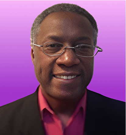 Portrait of a smiling man in glasses, black jacket, and red shirt on a purple background.