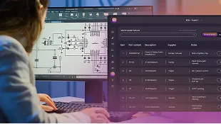 Person working at computer with technical schematic on one screen and data dashboard on another.