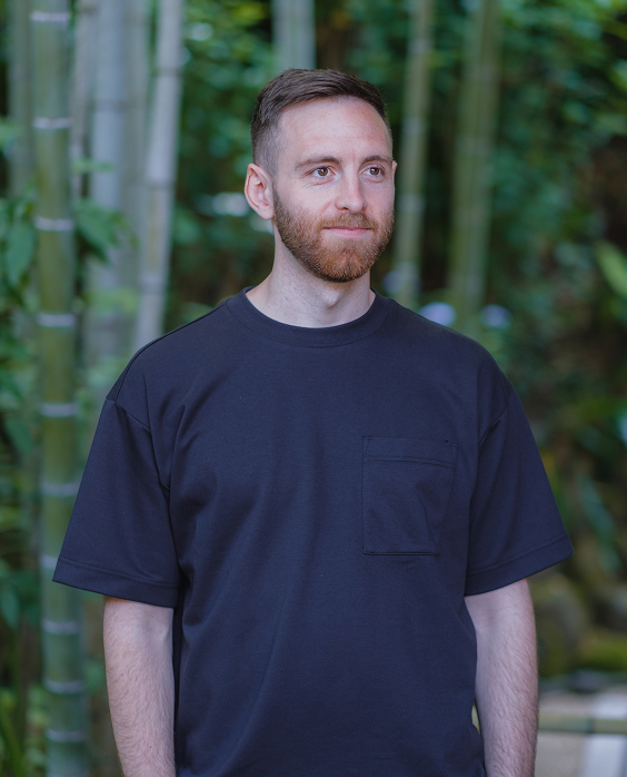 Headshot of Ryan Birse, UX/UI Designer and Developer, A white man with short brown hair and a short beard looking to the right of the camera.