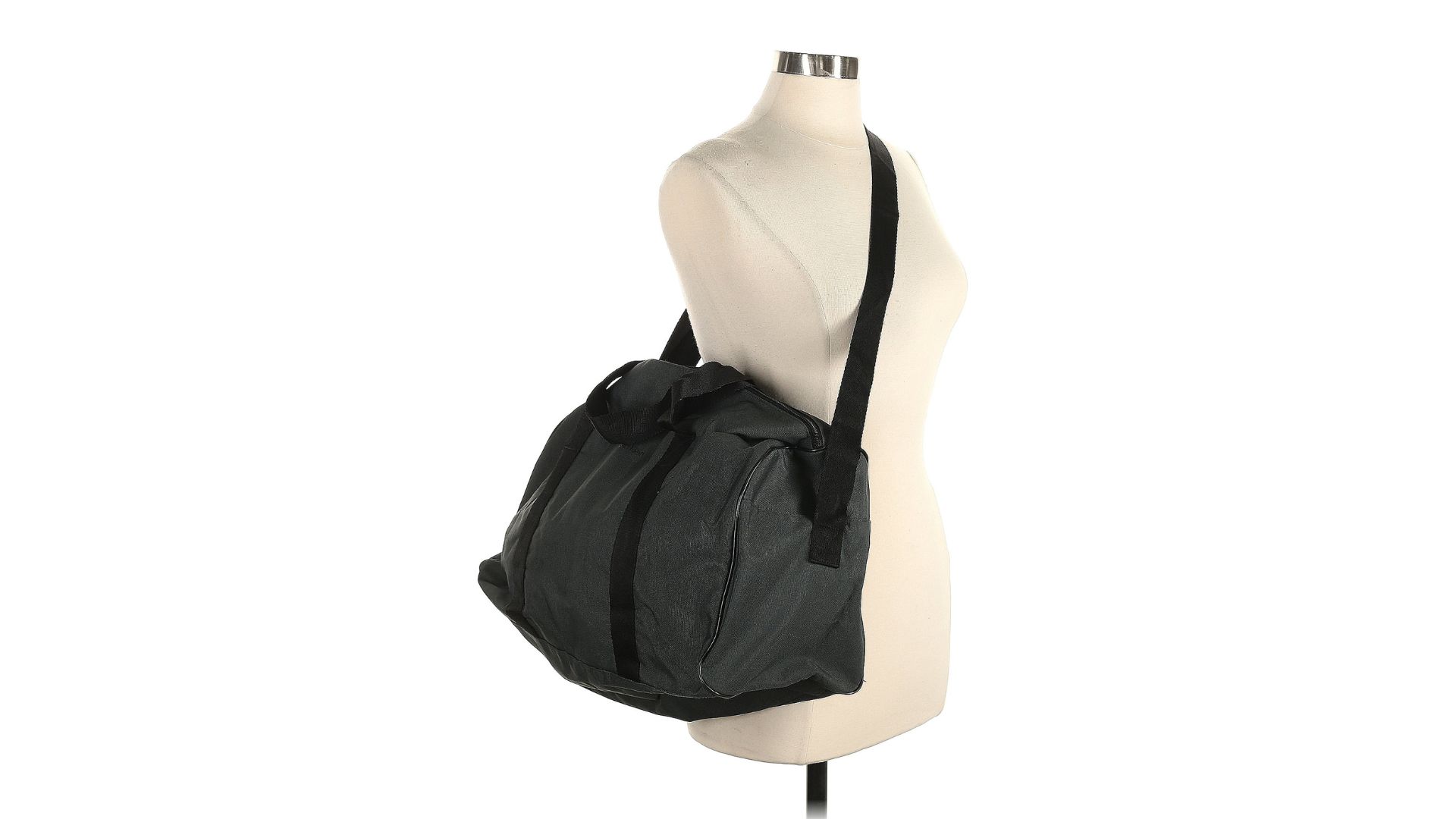 A dark gray duffle bag hanging from the strap on a torso-only mannequin.