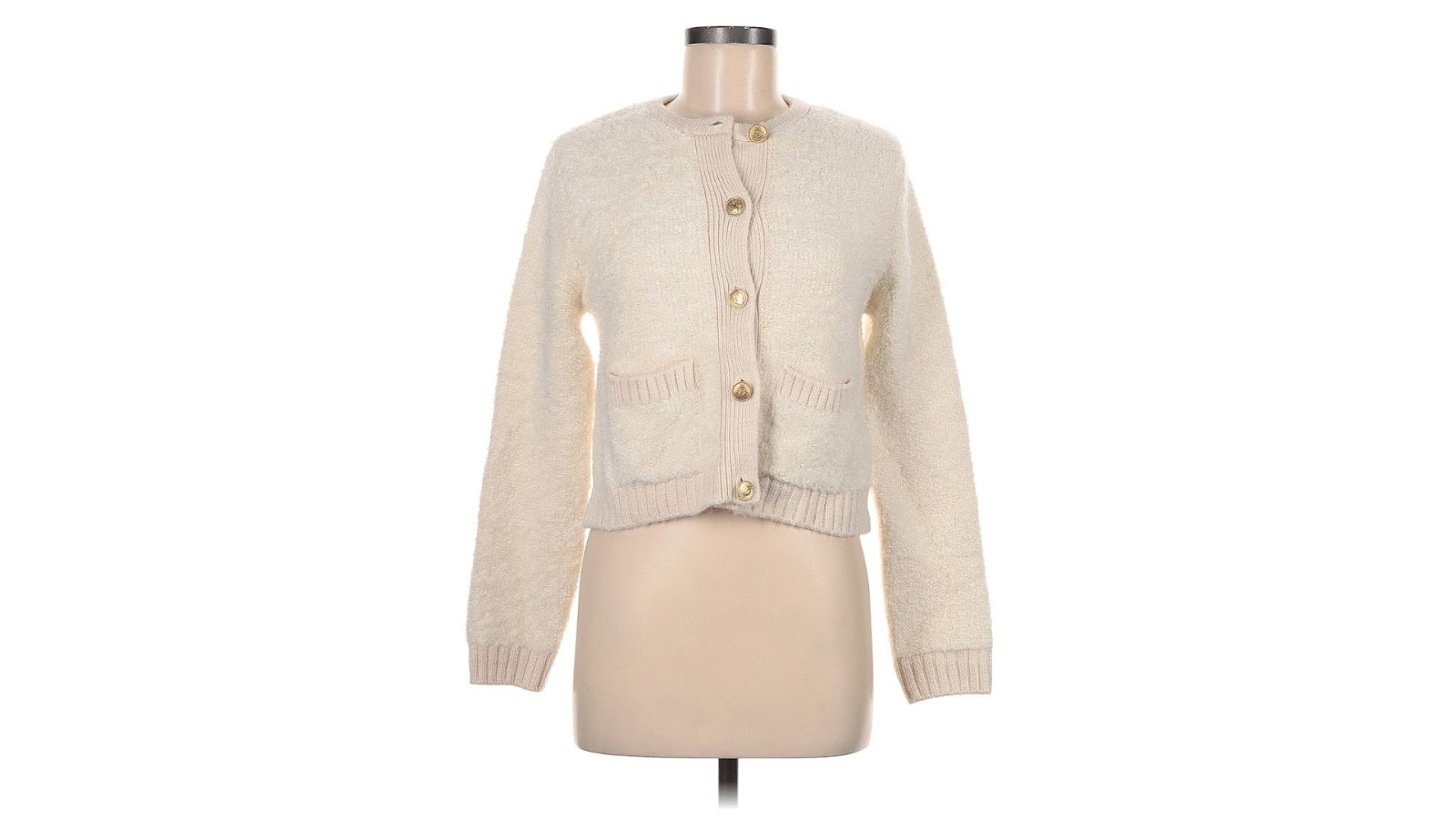 A white knit cardigan on a torso-only mannequin.