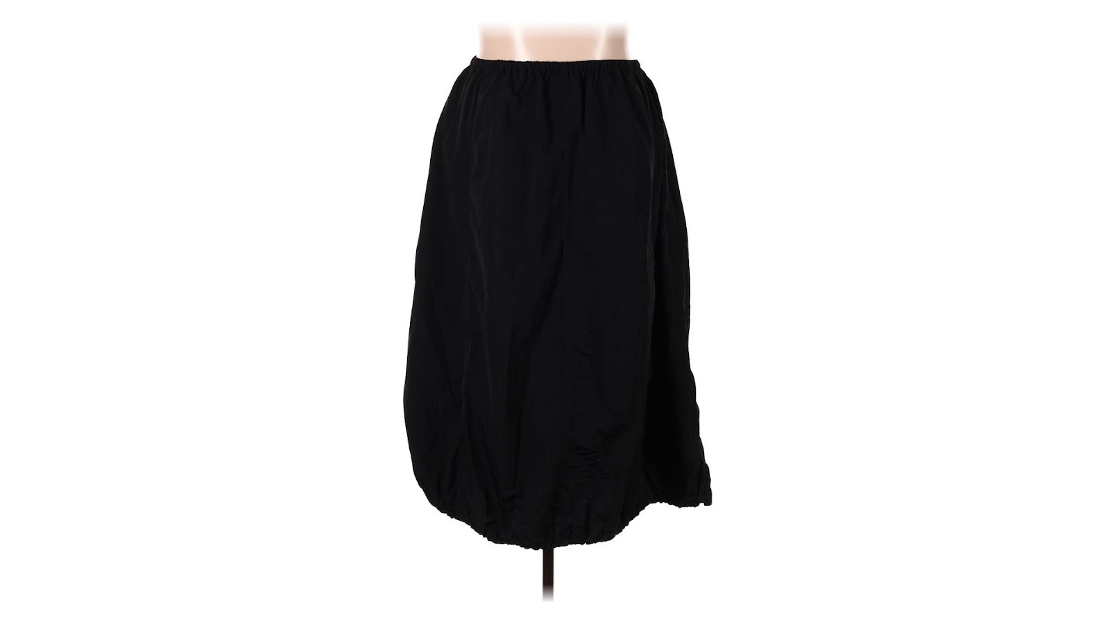 A black midi skirt on a torso-only mannequin.