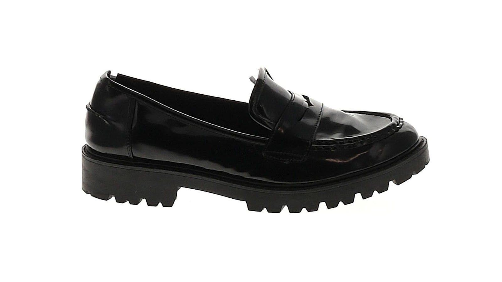 A black leather loafer on a white background.