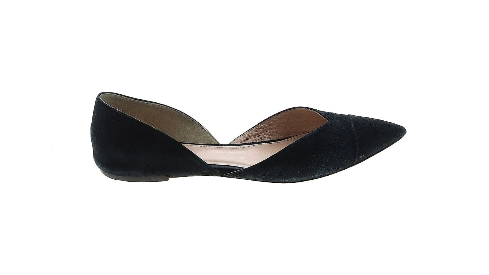 A black pointed-toe flat shoe.
