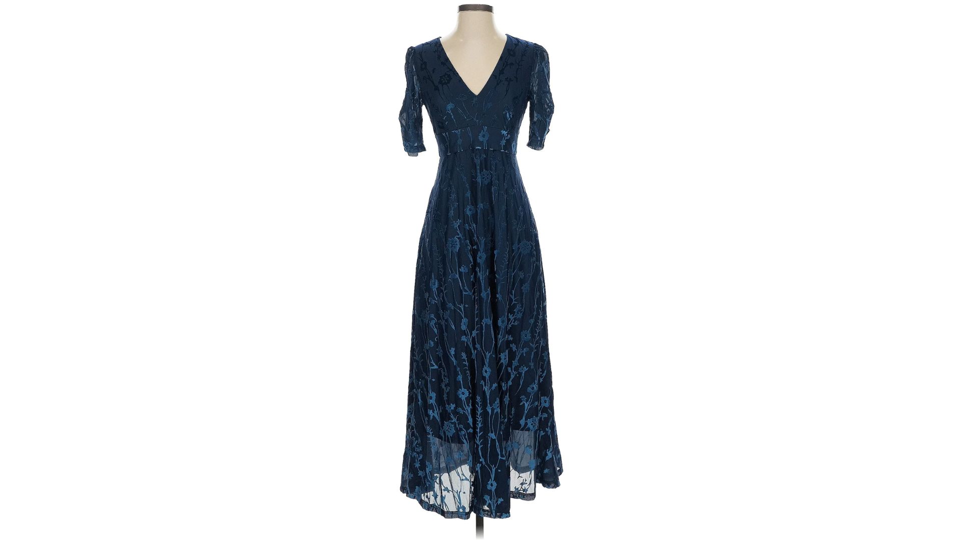 A dark blue floral cocktail dress from Anthropologie displayed on a mannequin against a white background.