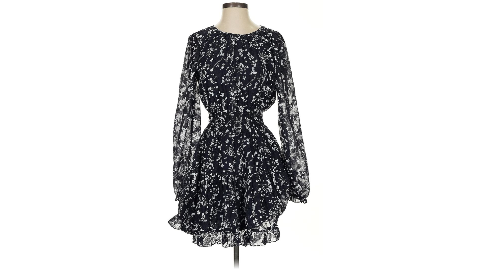 An image of a black floral mini dress from Lulus displayed on a mannequin against a white background.