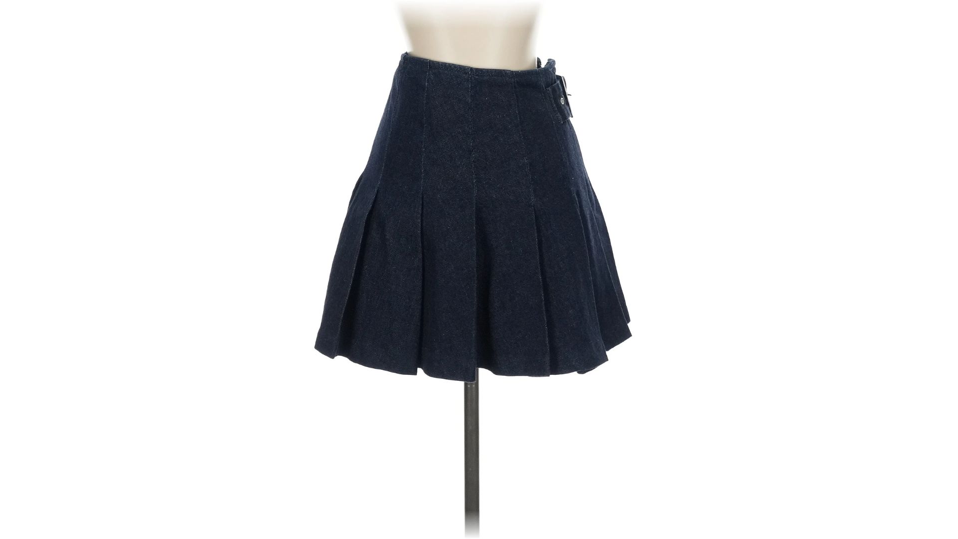 An image of a black mini skirt from Reformation displayed on a mannequin against a white background.