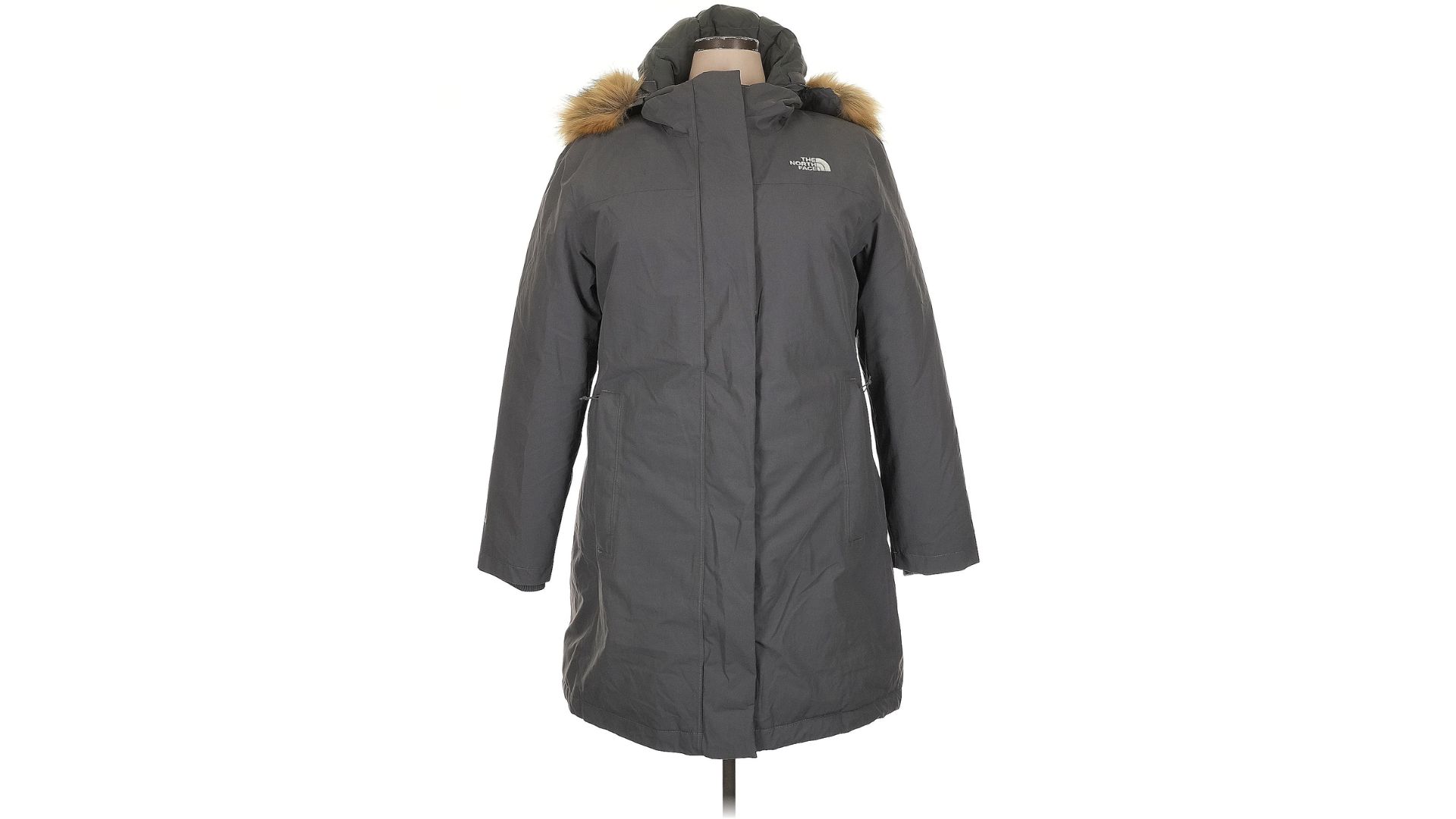 A gray The North Face Arctic Parka jacket on a mannequin.