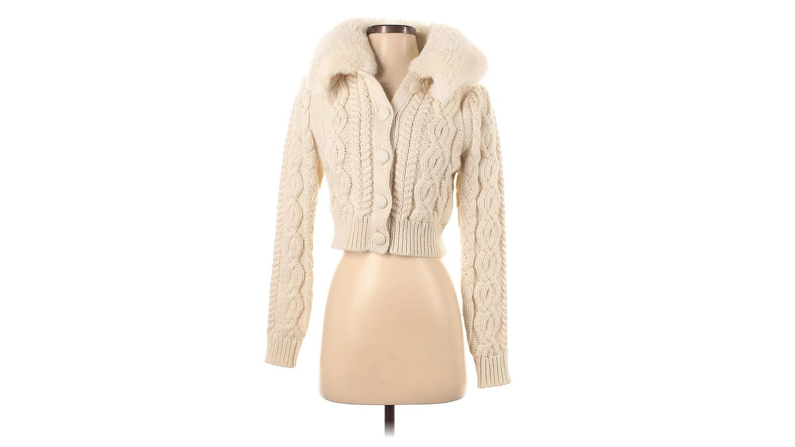 A white cardigan with fur accents from Zara.