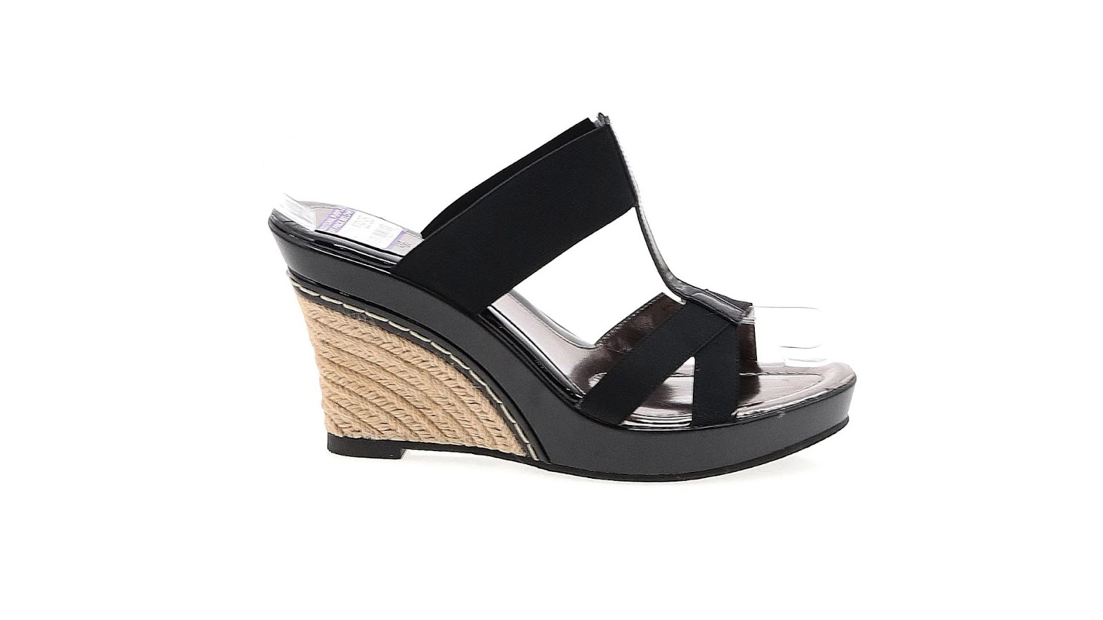 A black wedge heel with a high platform sole.
