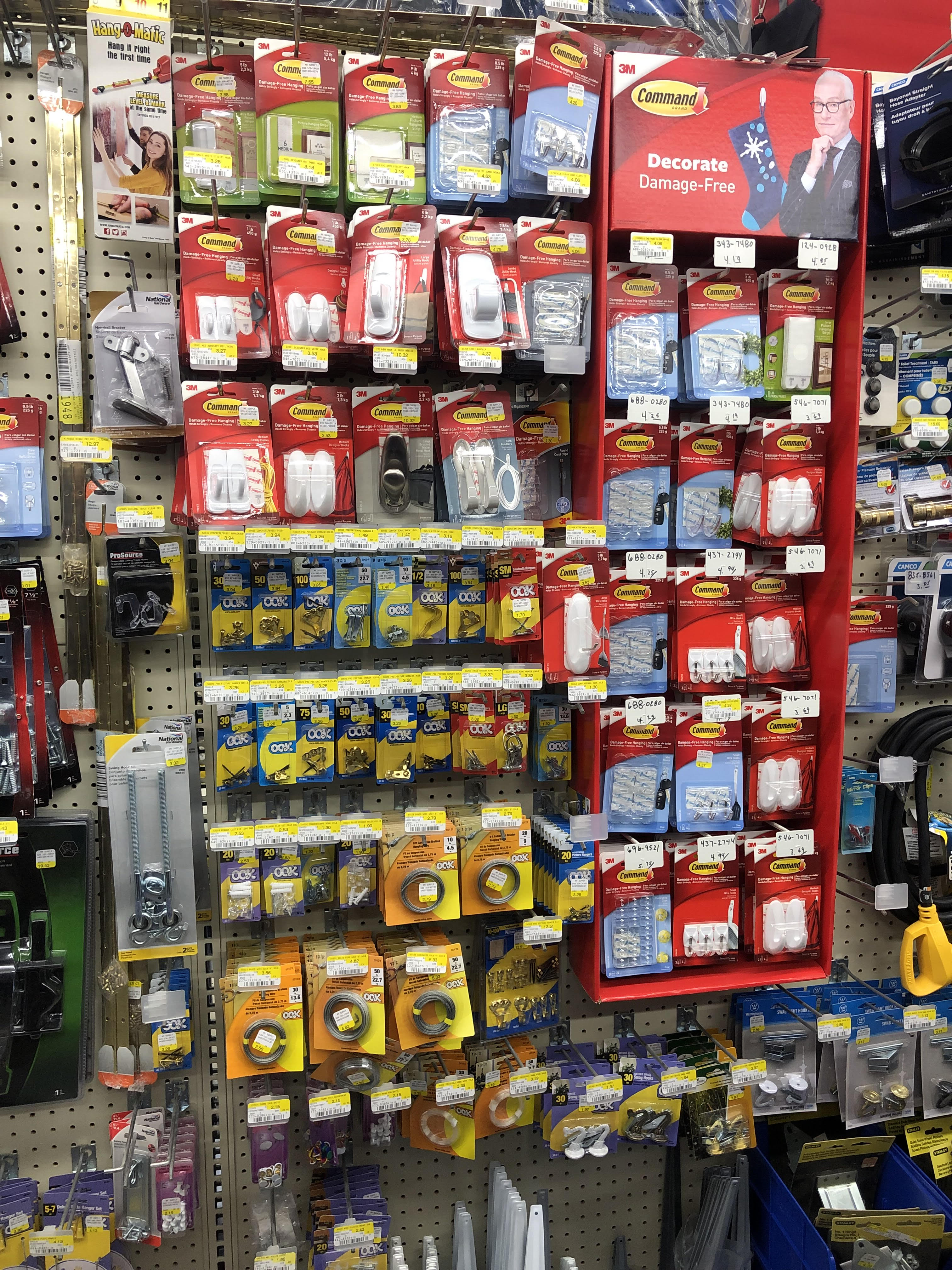Command hooks and adhesive products display in a hardware store