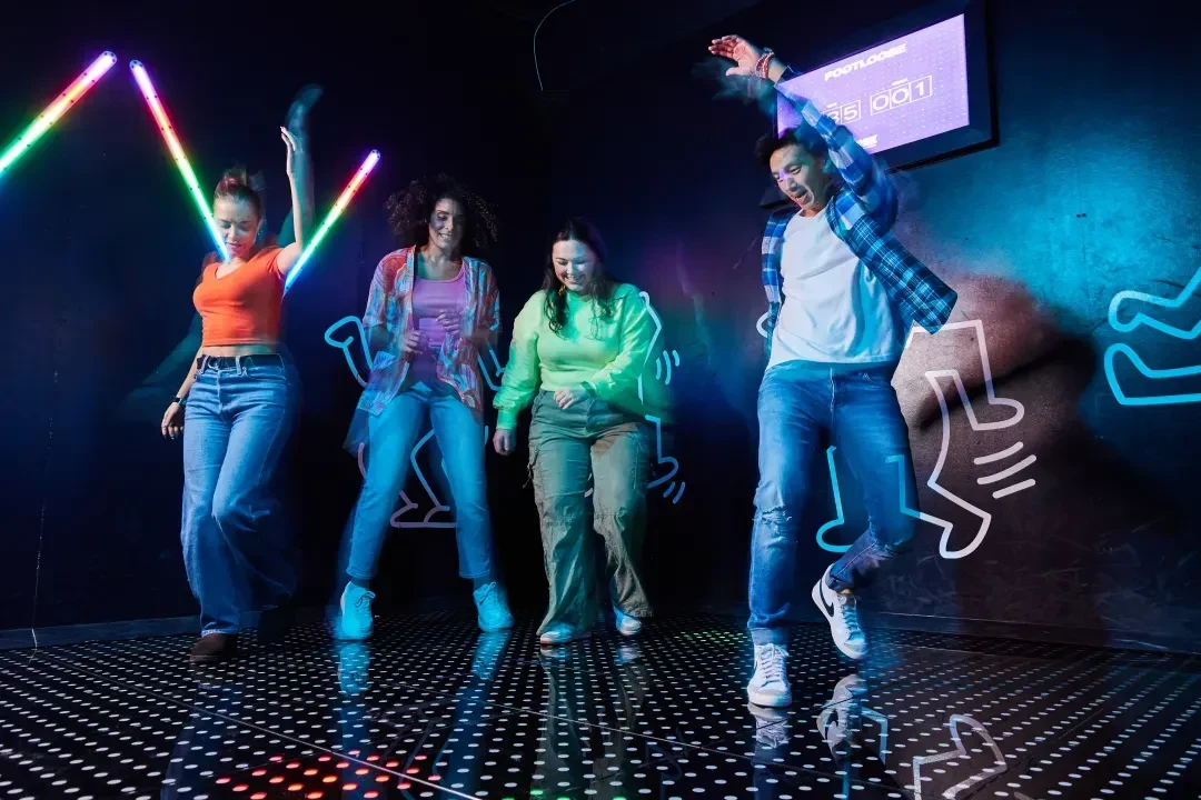 A group playing an immersive BRKTHROUGH challenge room