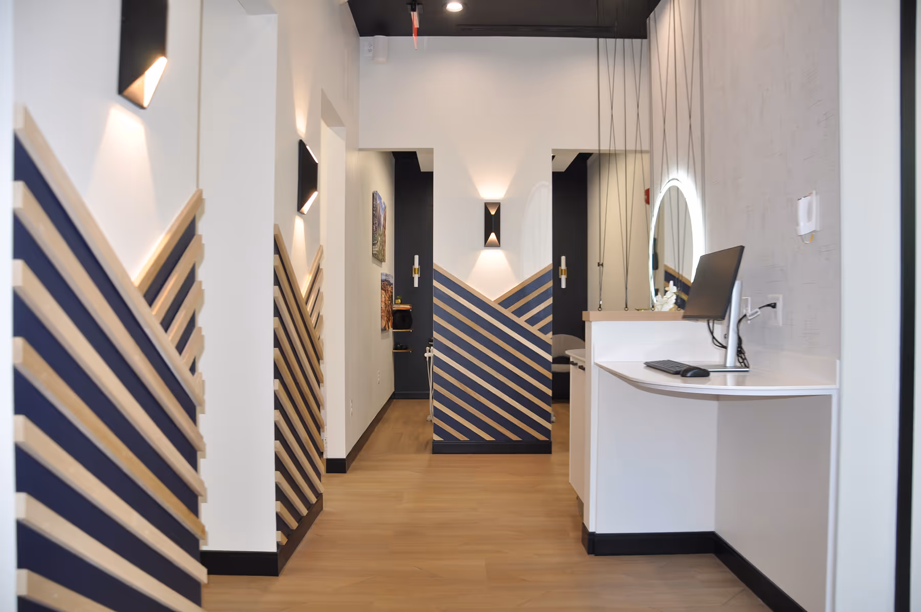 A bathroom with a sink and a mirror.