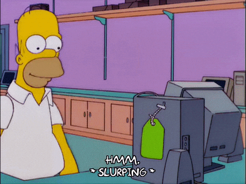 Homer Simpson looks at a computer with a price tag, captioned "Hmm. *slurping*"