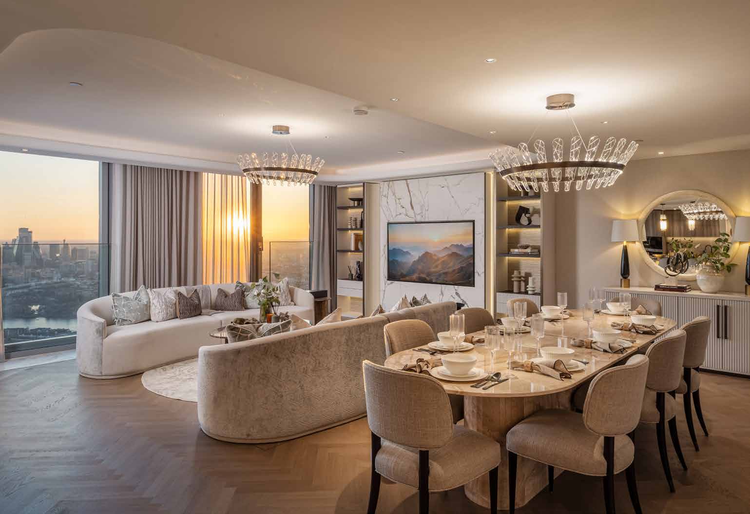 Penthouse kitchen with stone island, timber-effect cabinetry and bronze mirror details