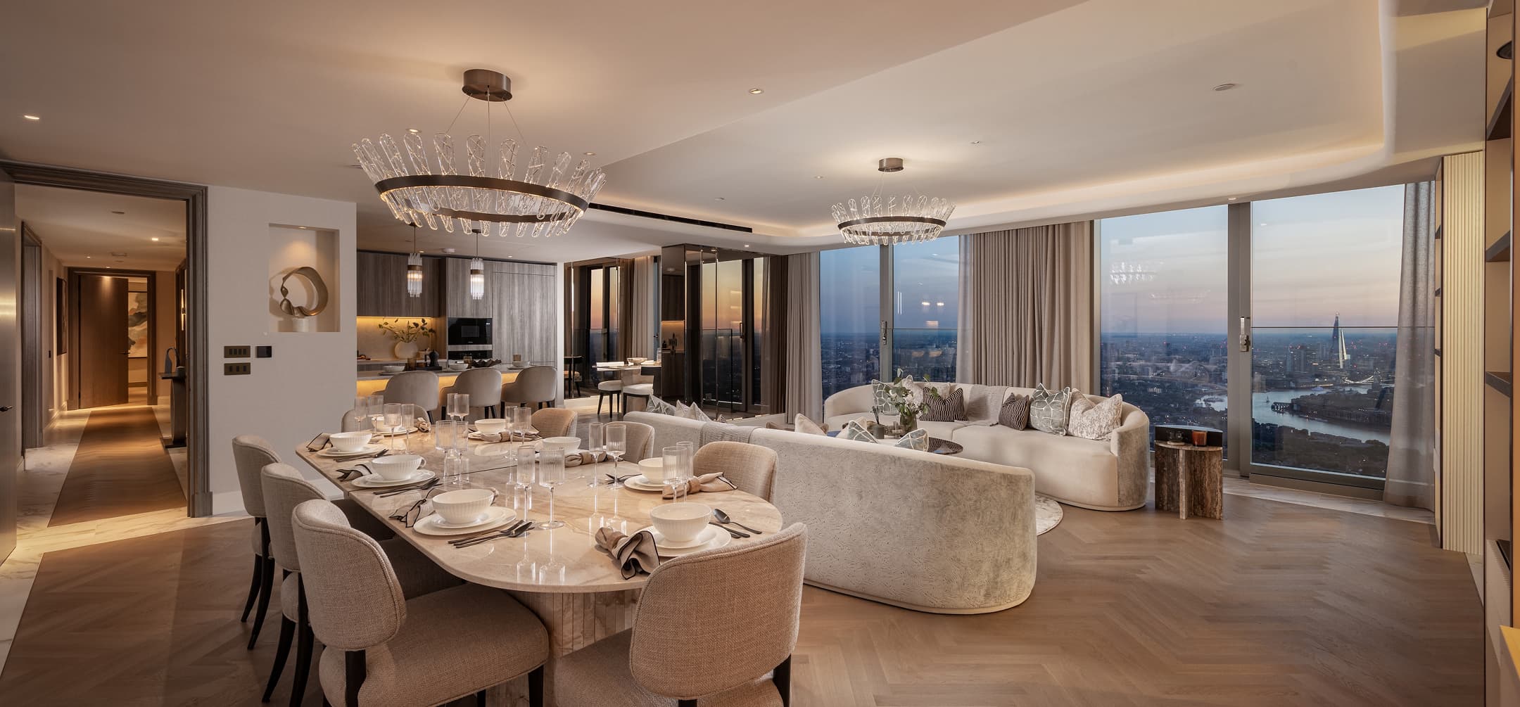 Sunset light across the penthouse living and dining room
