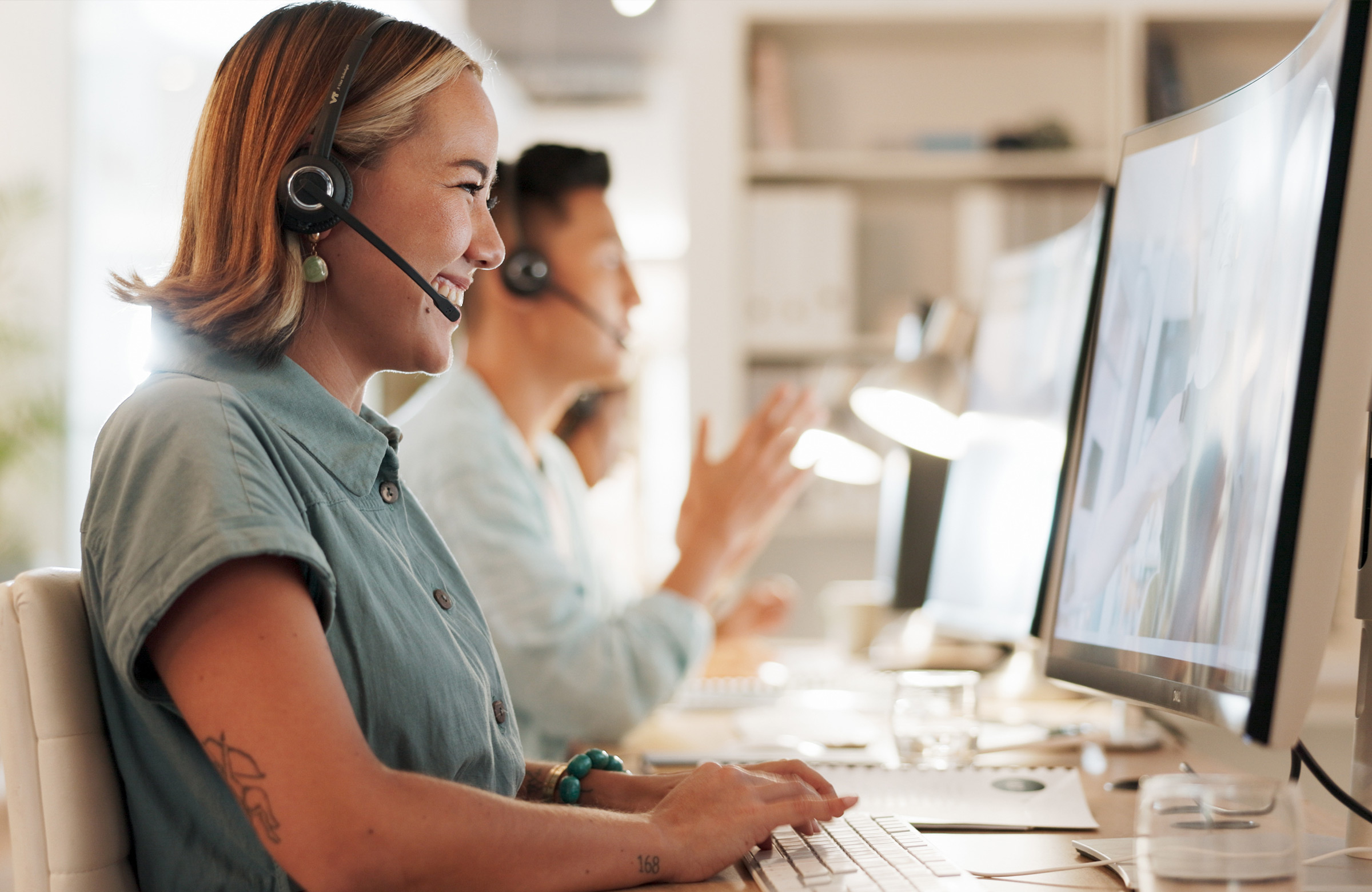 women enjoying work on computer
