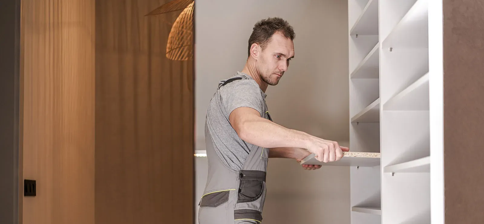 Installer installing shelf