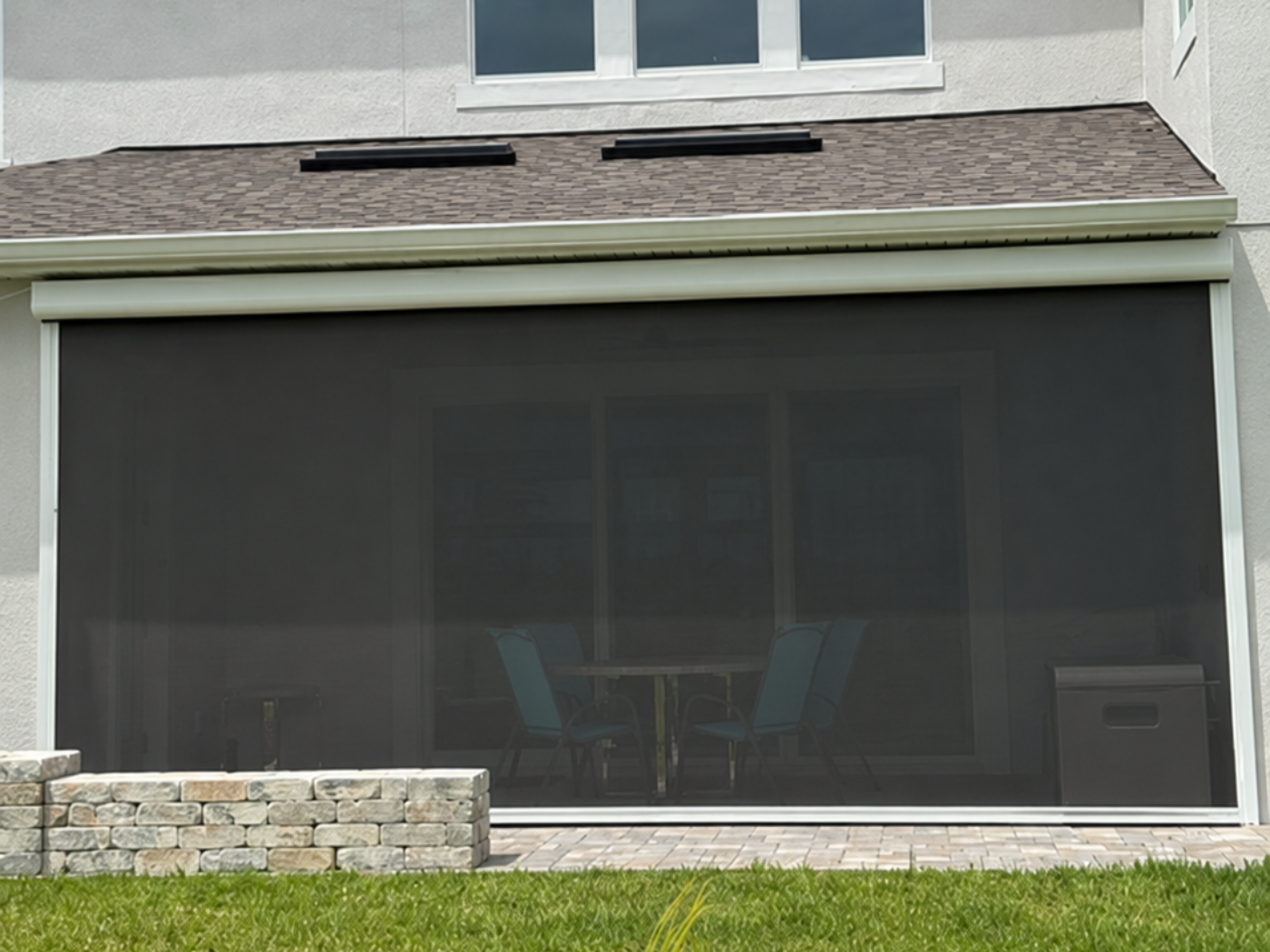 Black motorized hurricane screen for a lanai in Melbourne, FL. 