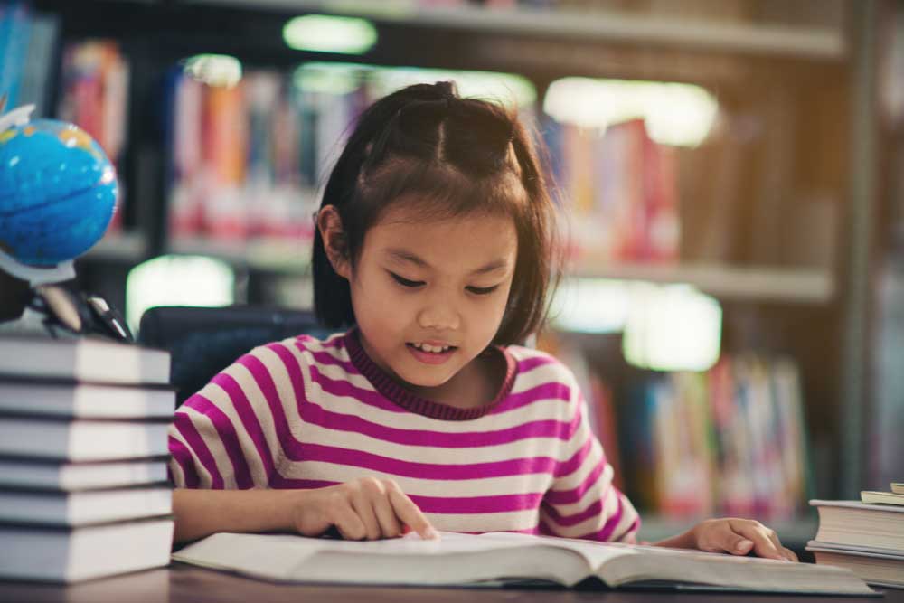 child preparing science answers with the cer method