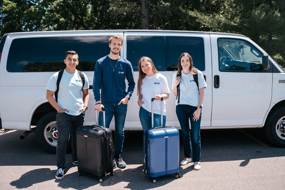 Retreat team outside of a van