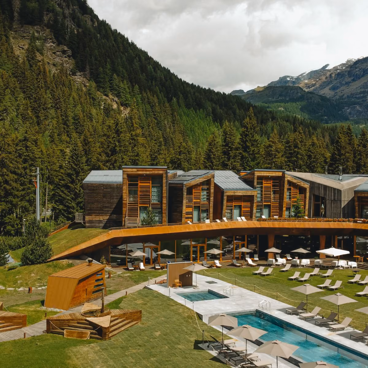 Aethos Monterosa Hotel exterior garden with heated pool in Champoluc
