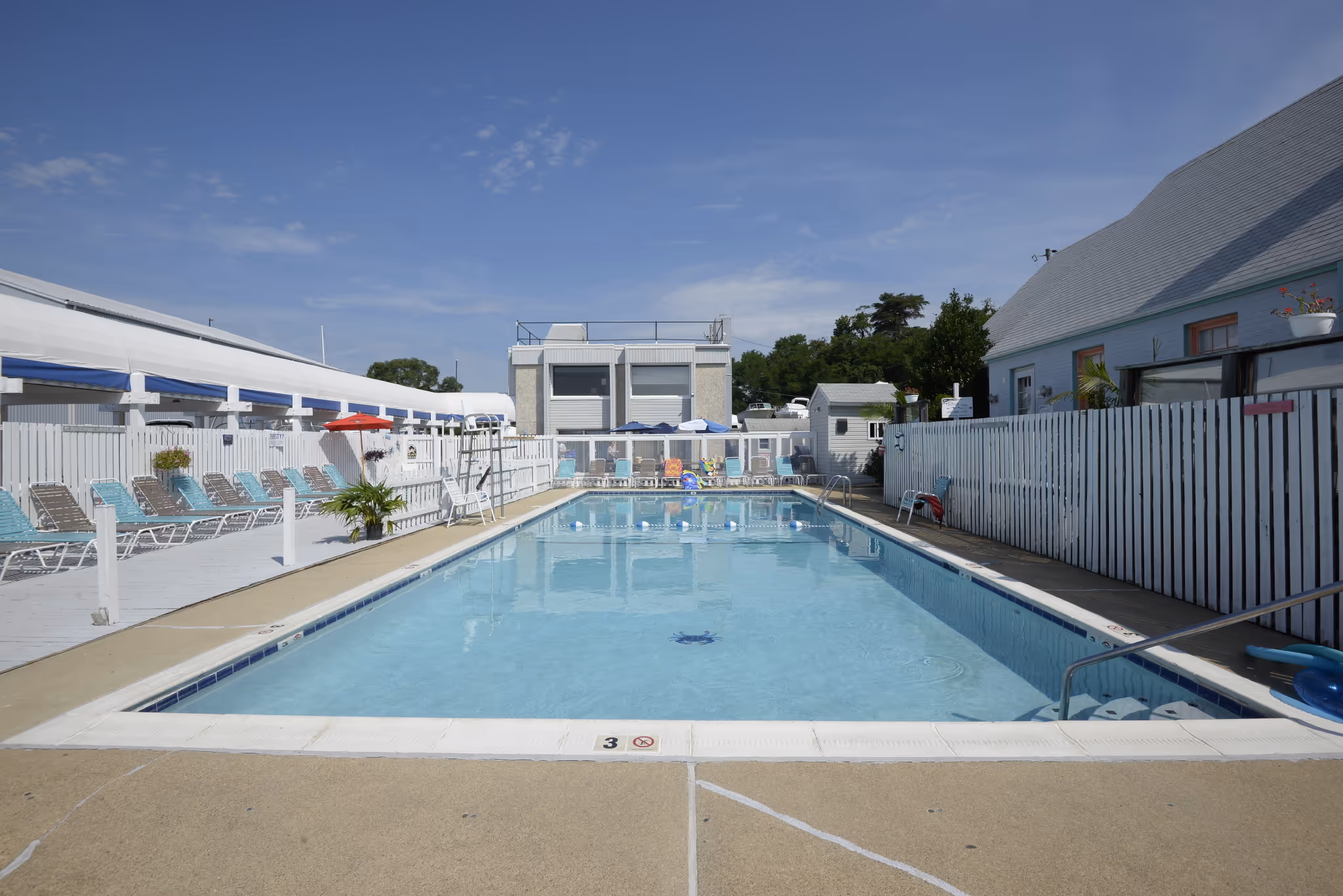 Liberty Marina Boating Community pool image showing boaters relaxing and swimming, capturing the social and recreational atmosphere of the marina.