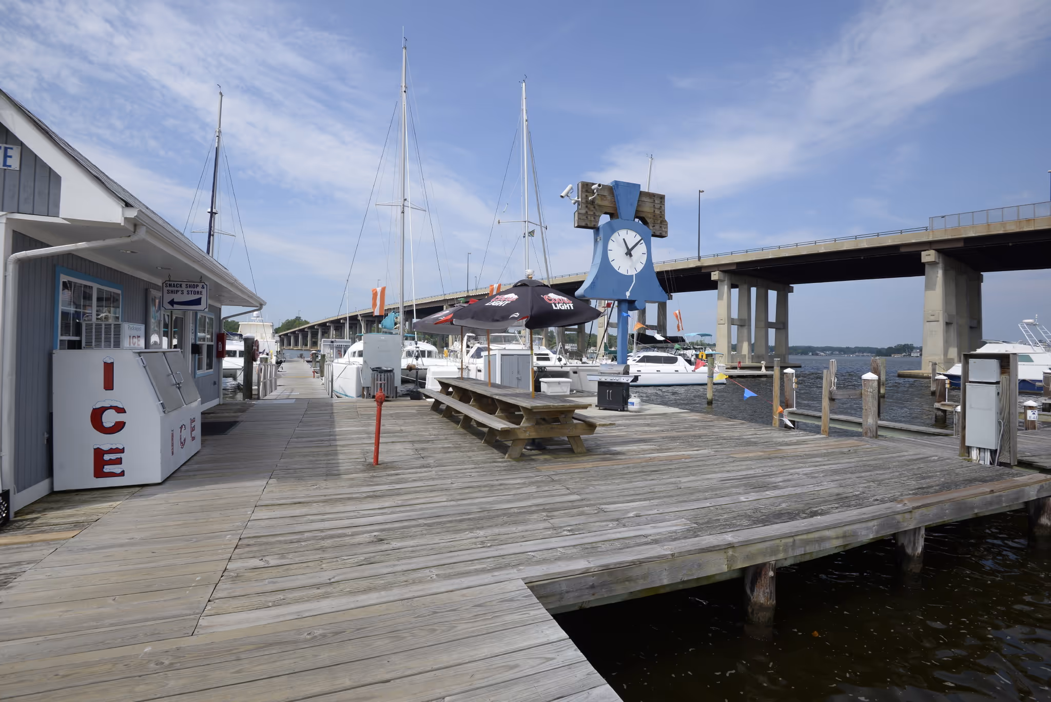 Liberty Marina Boating Community picnic tables image showing waterfront seating areas where boaters gather for meals and social events.