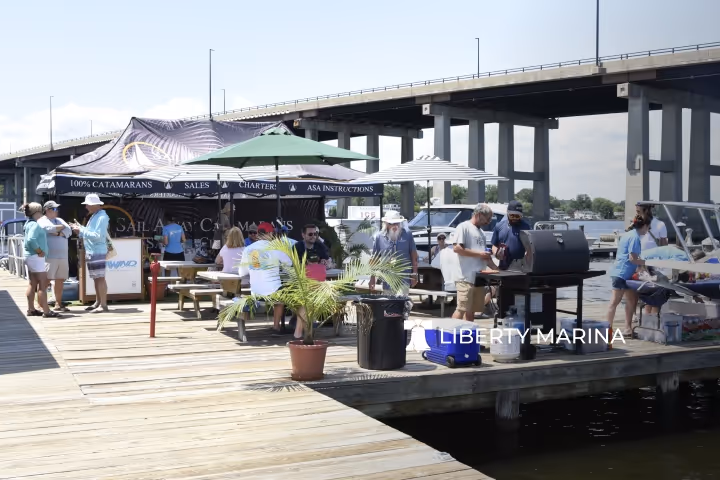 Liberty Marina Boating Community events image featuring boaters socializing by the waterfront, highlighting gatherings and community activities.