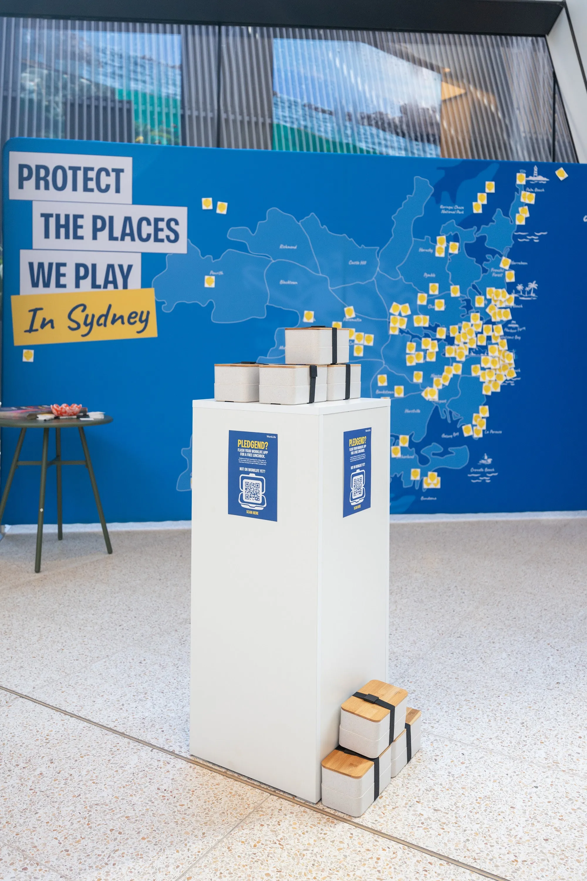 The JLL pledge wall and stand in the building lobby